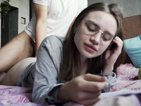 Russian nerdy girl gets prone boned while working on the bed