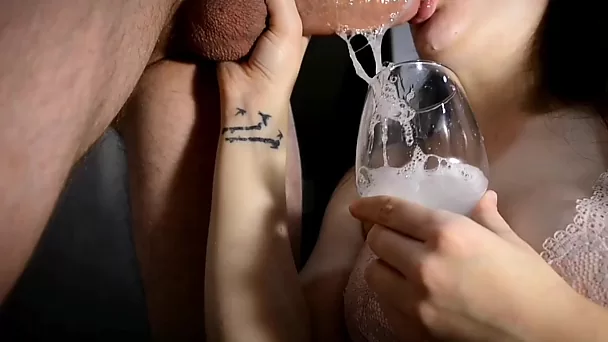 Drinking saliva and cum from the glass after a sloppy throatfuck