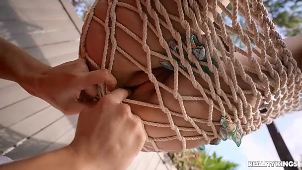Voluptuous redhead Aria Kai makes use of hammock while fucking big dick in backyard