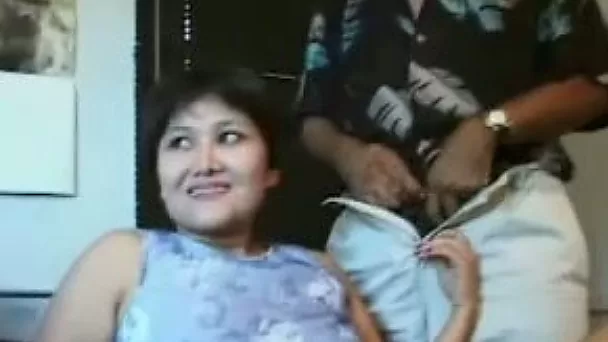 Short-haired Asian brunette is ready to please two cocks at a time