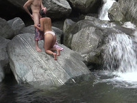 Beautiful waterfall made two teens horny and they climbed on a rock to have sex there