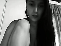 Stunnin brunette amateur strips on webcam and masturbates