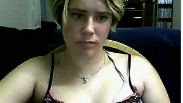 Boring German blondie demonstrates her boob with poker face